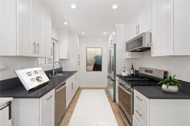 11440 Gothic Ave, Granada Hills, CA 91344 - kitchen featuring appliances with stainless steel finishes, dark countertops, white cabinetry, and recessed lighting