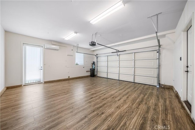 1379 Point Loma Pl, Walnut, CA 91789 - garage with a wall unit AC and a garage door opener