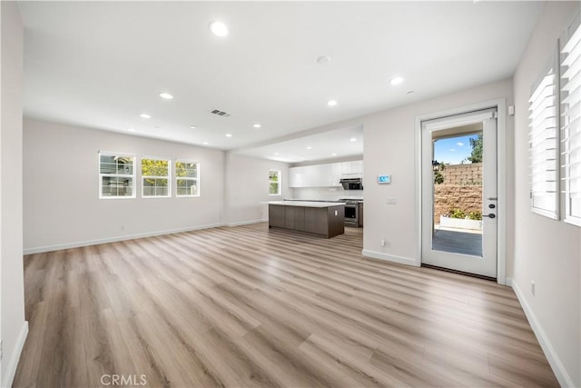 1379 Point Loma Pl, Walnut, CA 91789 - unfurnished living room with light wood-style flooring, plenty of natural light, and recessed lighting