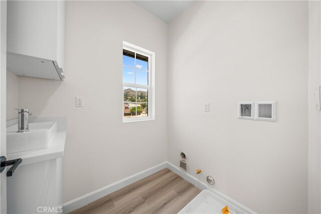 1379 Point Loma Pl, Walnut, CA 91789 - laundry area with hookup for a gas dryer and light wood-type flooring