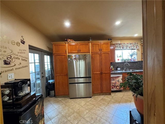 531 N Rossmore Ave Unit 202, Los Angeles, CA 90004 - kitchen featuring freestanding refrigerator, dishwasher, french doors, brown cabinetry, and recessed lighting