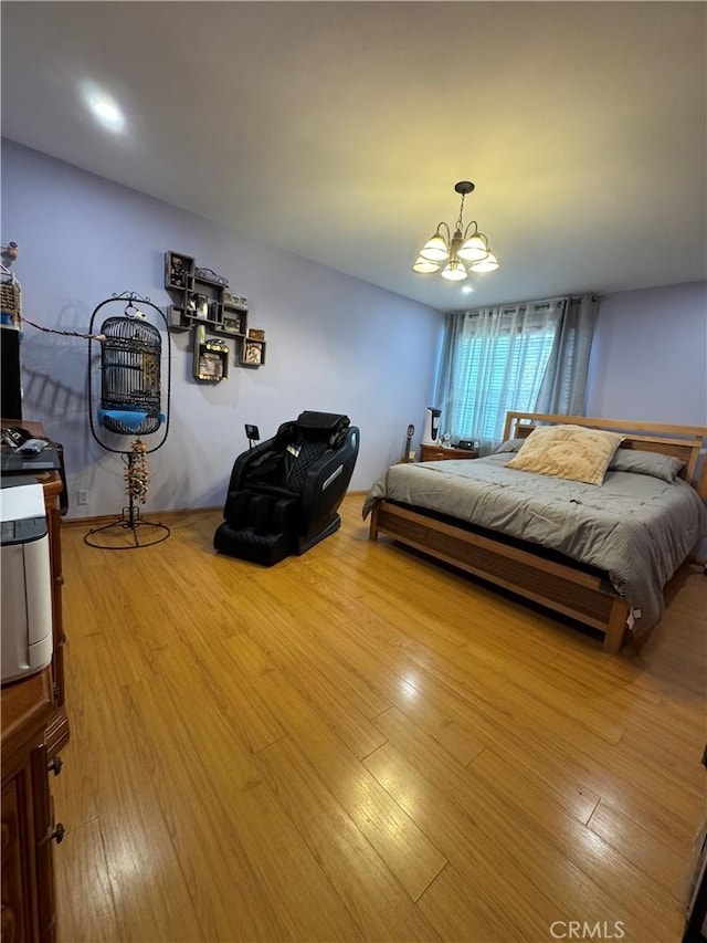 531 N Rossmore Ave Unit 202, Los Angeles, CA 90004 - bedroom with a chandelier and wood finished floors