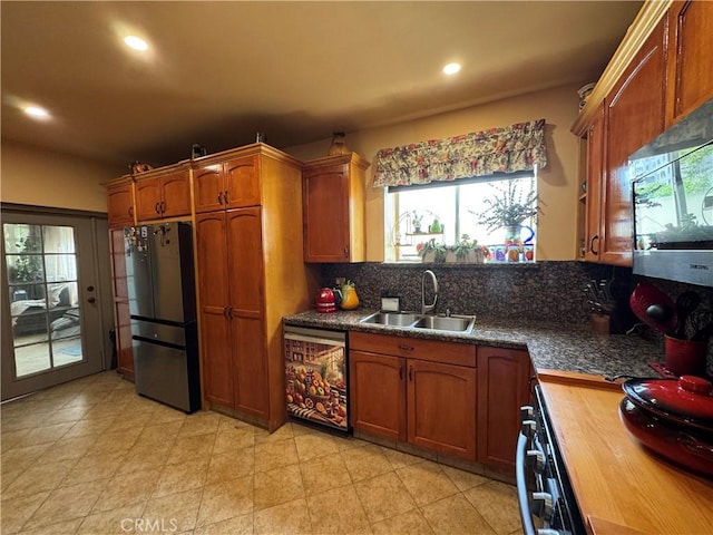 531 N Rossmore Ave Unit 202, Los Angeles, CA 90004 - kitchen featuring appliances with stainless steel finishes, recessed lighting, tasteful backsplash, and brown cabinetry