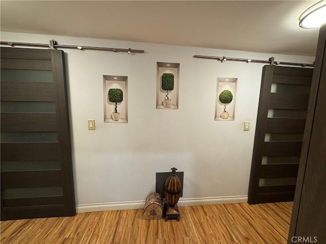 531 N Rossmore Ave Unit 202, Los Angeles, CA 90004 - detailed view of a barn door and wood finished floors
