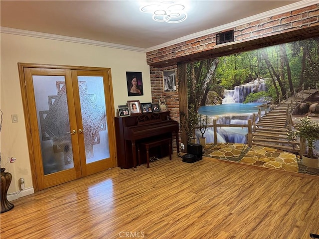 531 N Rossmore Ave Unit 202, Los Angeles, CA 90004 - sitting room featuring wood finished floors, french doors, ornamental molding, and brick wall