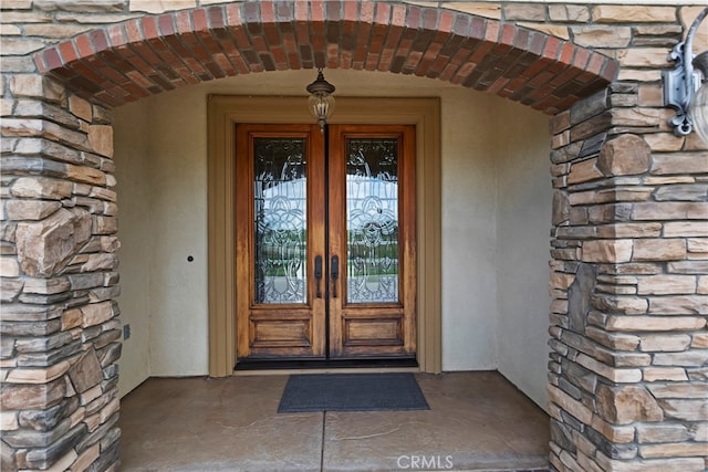 36090 Monte De Oro Rd, Temecula, CA 92592 - property entrance with french doors, stone siding, and stucco siding