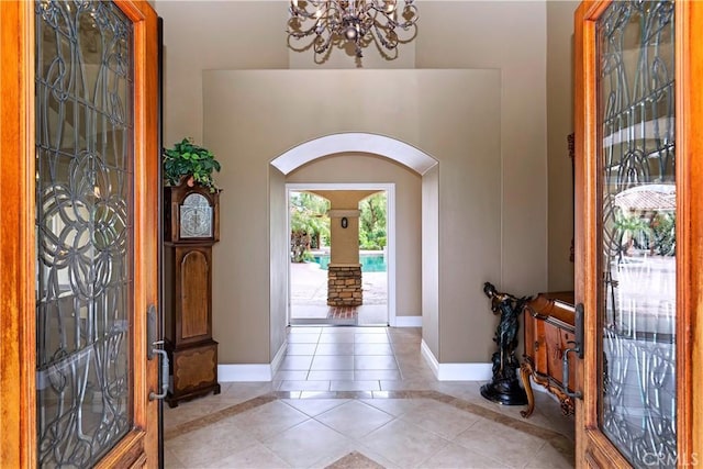 36090 Monte De Oro Rd, Temecula, CA 92592 - entrance foyer featuring arched walkways, light tile patterned flooring, and a chandelier
