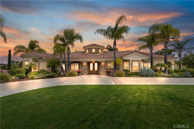 36090 Monte De Oro Rd, Temecula, CA 92592 - mediterranean / spanish house featuring french doors, a tiled roof, a yard, stone siding, and stucco siding
