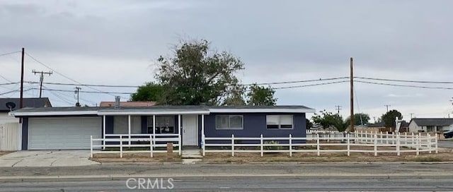 8636 California City Blvd, California City, CA 93505 - ranch-style home with a fenced front yard, a garage, and driveway
