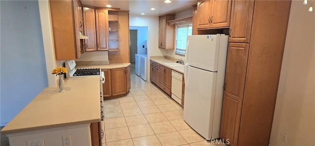509 N 3rd St, Lompoc, CA 93436 - kitchen with white appliances, light countertops, recessed lighting, light tile patterned flooring, and brown cabinetry