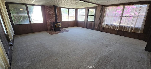 509 N 3rd St, Lompoc, CA 93436 - unfurnished sunroom featuring a wood stove