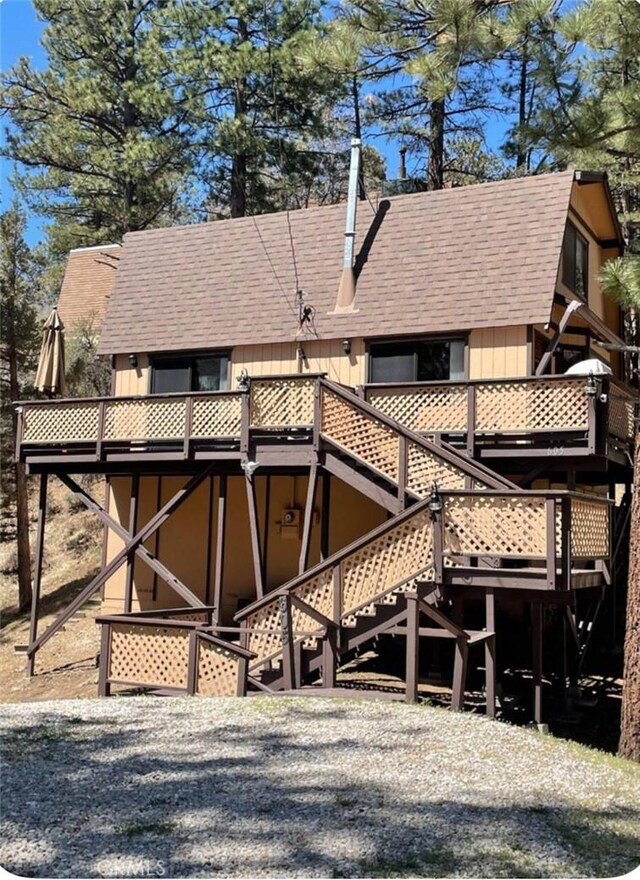 605 Kean Way, Big Bear City, CA 92314 - rear view of property featuring a shingled roof, stairway, and a deck