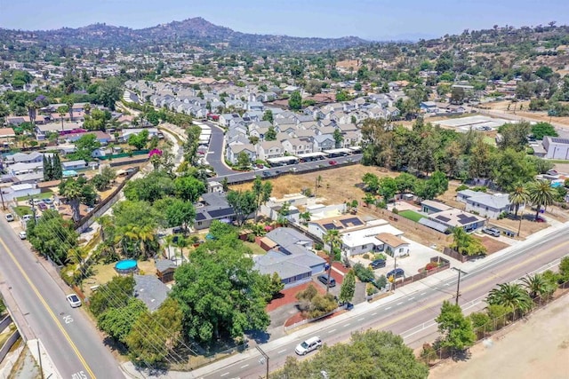 8802 Tyler St, Spring Valley, CA 91977 - aerial overview of property's location with nearby suburban area and a mountainous background