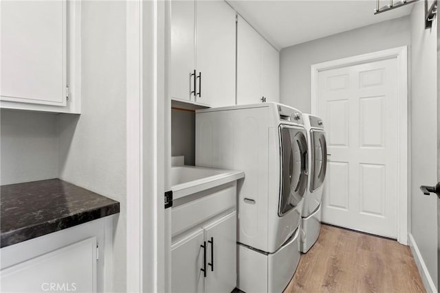 662 January St, Nipomo, CA 93444 - laundry area with washing machine and dryer, cabinet space, and light wood-style floors