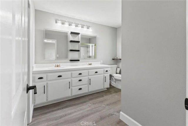 662 January St, Nipomo, CA 93444 - bathroom with double vanity, an enclosed shower, and wood finished floors