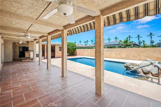 75406 Montecito Dr, Indian Wells, CA 92210 - view of swimming pool featuring ceiling fan, a patio, and a fenced backyard