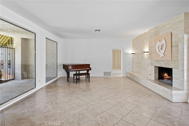 75406 Montecito Dr, Indian Wells, CA 92210 - living room featuring a fireplace and light tile patterned floors
