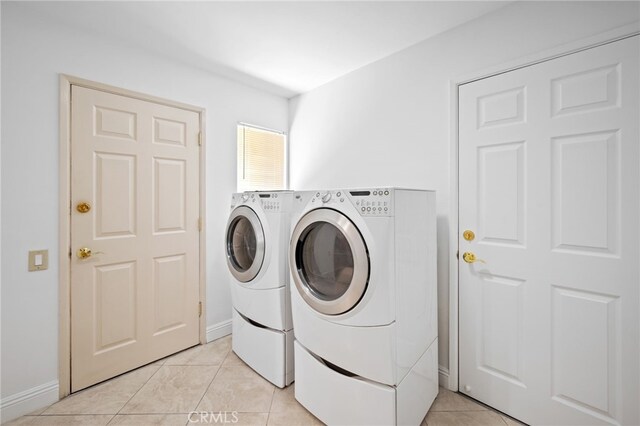 75406 Montecito Dr, Indian Wells, CA 92210 - laundry area with washing machine and clothes dryer and light tile patterned floors