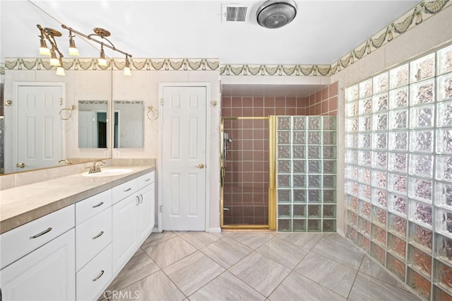 75406 Montecito Dr, Indian Wells, CA 92210 - full bathroom featuring tiled shower, vanity, and tile patterned flooring