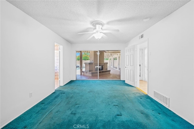 75406 Montecito Dr, Indian Wells, CA 92210 - carpeted empty room with a ceiling fan and a textured ceiling