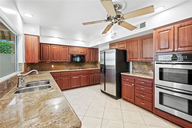 75406 Montecito Dr, Indian Wells, CA 92210 - kitchen featuring black appliances, backsplash, ceiling fan, light tile patterned floors, and recessed lighting