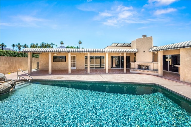 75406 Montecito Dr, Indian Wells, CA 92210 - view of swimming pool with an outdoor fireplace and a patio