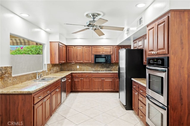 75406 Montecito Dr, Indian Wells, CA 92210 - kitchen with black appliances, ceiling fan, light tile patterned floors, and tasteful backsplash