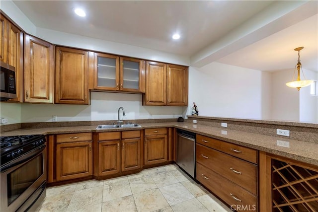 4568 W 1st St Unit 203, Los Angeles, CA 90004 - kitchen featuring appliances with stainless steel finishes, brown cabinetry, glass insert cabinets, and dark stone counters