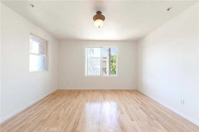 4568 W 1st St Unit 203, Los Angeles, CA 90004 - empty room with light wood-style floors and baseboards