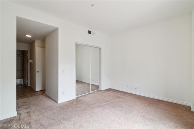 2960 Champion Way Unit 1006, Tustin, CA 92782 - unfurnished bedroom featuring carpet and a closet