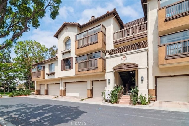 2960 Champion Way Unit 1006, Tustin, CA 92782 - view of property featuring a garage