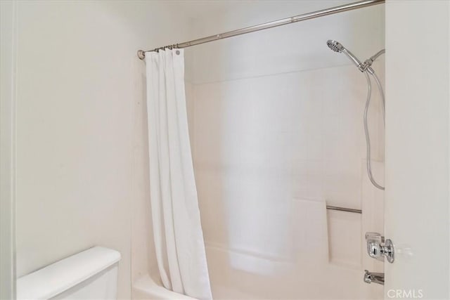 2960 Champion Way Unit 1006, Tustin, CA 92782 - bathroom featuring shower / bath combo with shower curtain and toilet