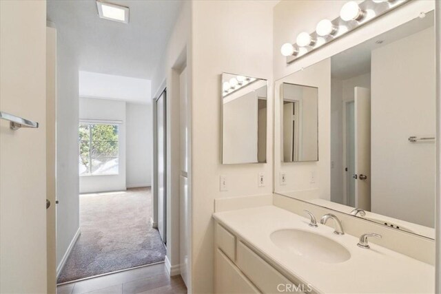 2960 Champion Way Unit 1006, Tustin, CA 92782 - bathroom with vanity and baseboards