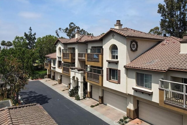 2960 Champion Way Unit 1006, Tustin, CA 92782 - view of building exterior featuring an attached garage