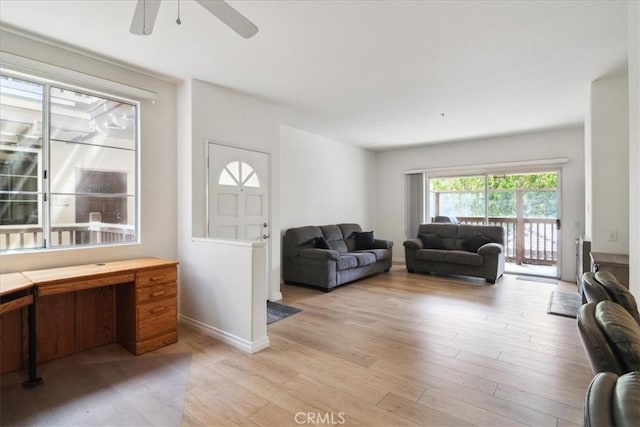 2960 Champion Way Unit 1006, Tustin, CA 92782 - living area with light wood-style flooring, ceiling fan, and a desk