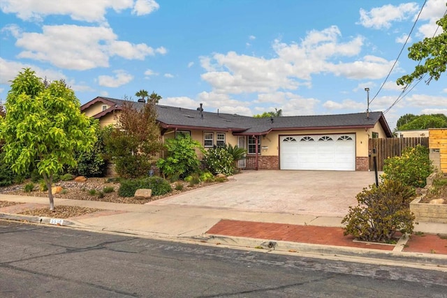 5530 Heidi St, La Mesa, CA 91942 - view of front facade with driveway, a garage, brick siding, and stucco siding