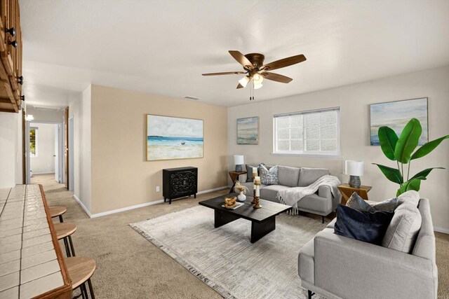 5530 Heidi St, La Mesa, CA 91942 - living area featuring light colored carpet, a ceiling fan, and healthy amount of natural light