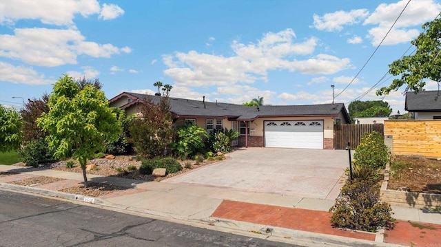 5530 Heidi St, La Mesa, CA 91942 - view of front facade featuring an attached garage, driveway, and stucco siding