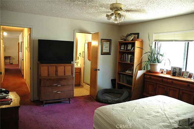 30717 Seminole Dr, Coarsegold, CA 93614 - bedroom featuring carpet flooring, connected bathroom, and a textured ceiling