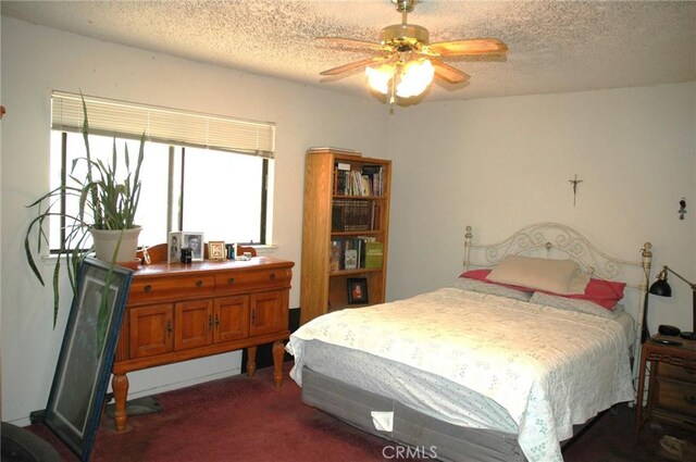 30717 Seminole Dr, Coarsegold, CA 93614 - bedroom featuring a textured ceiling and dark carpet