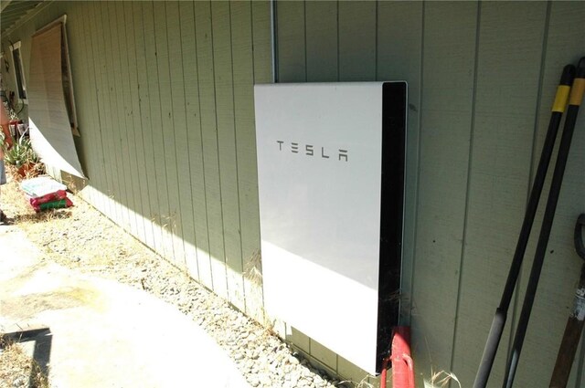 30717 Seminole Dr, Coarsegold, CA 93614 - exterior view of wall-mounted power storage