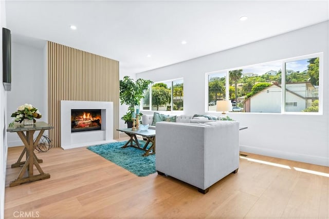 32862 Bluffside Dr, Dana Point, CA 92629 - living area with light wood-type flooring, a warm lit fireplace, and recessed lighting