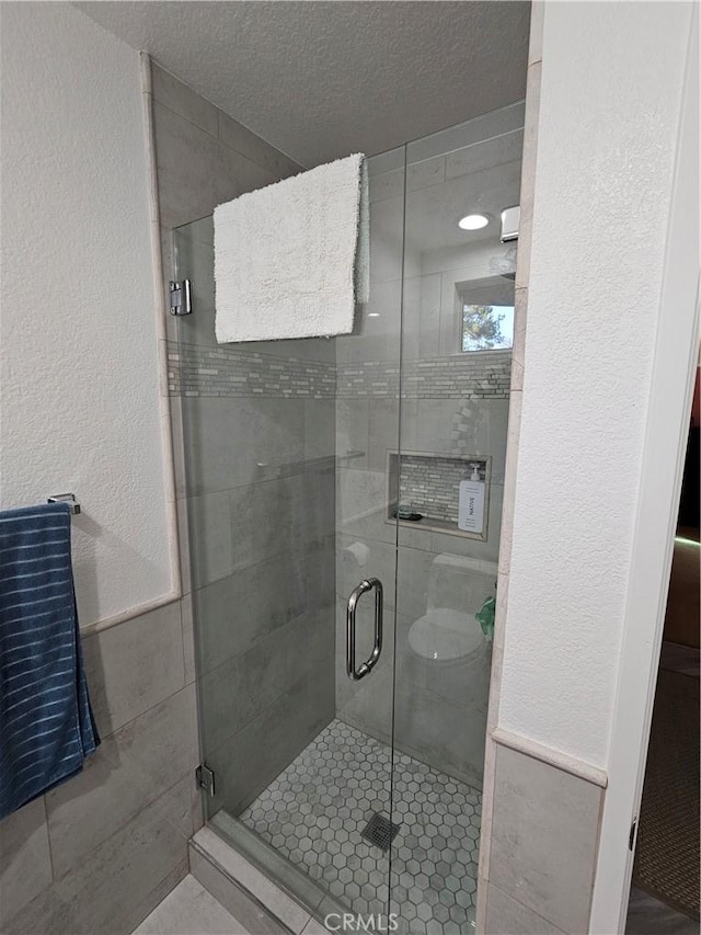 24377 Larchmont Ct Unit 32, Laguna Hills, CA 92653 - full bath featuring a stall shower and a textured ceiling