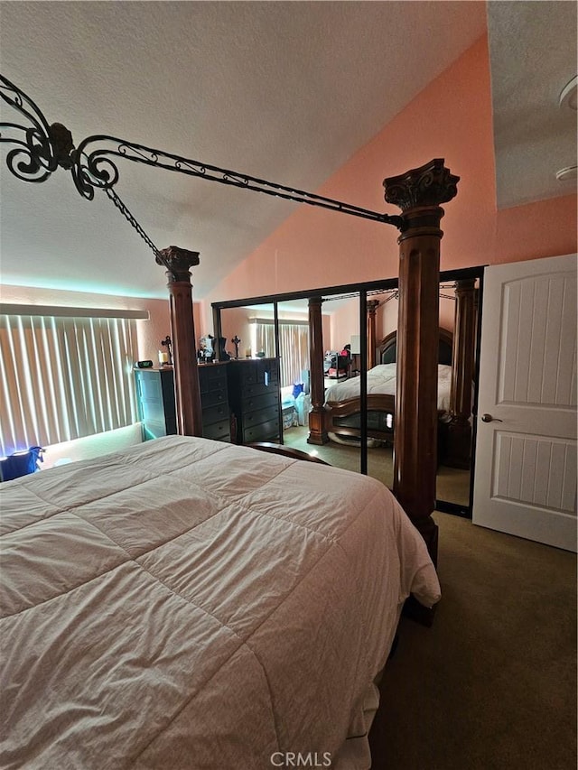 24377 Larchmont Ct Unit 32, Laguna Hills, CA 92653 - carpeted bedroom with ornate columns, vaulted ceiling, and a textured ceiling