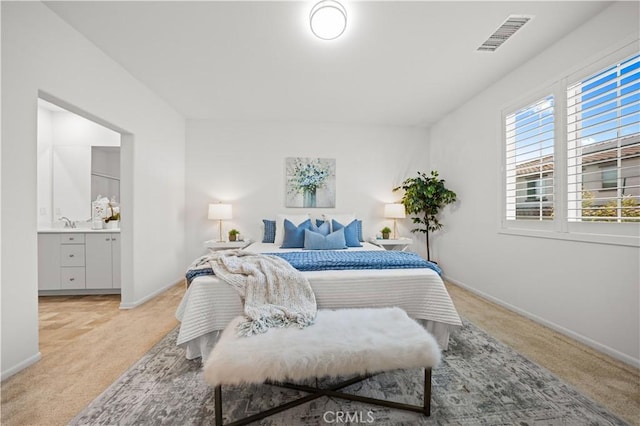 5603 Kate Way Unit 4, Fontana, CA 92336 - bedroom featuring light colored carpet and ensuite bath