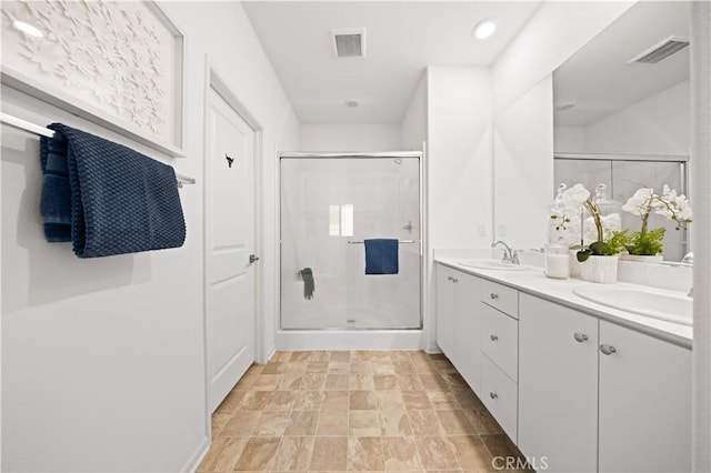 5603 Kate Way Unit 4, Fontana, CA 92336 - full bathroom with a stall shower, double vanity, and stone finish floors