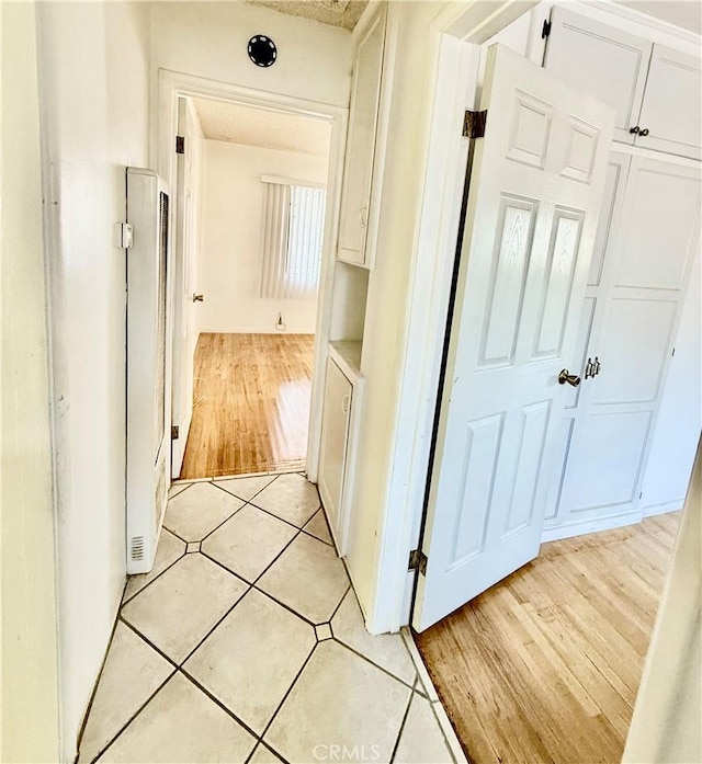 1526 Lakme Ave, Wilmington, CA 90744 - hallway featuring light tile patterned floors
