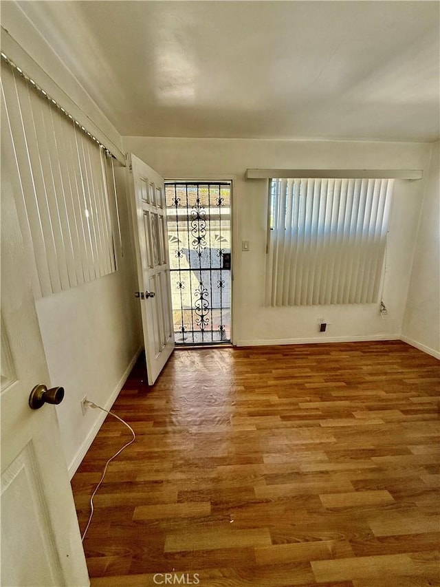 1526 Lakme Ave, Wilmington, CA 90744 - empty room featuring baseboards and wood finished floors