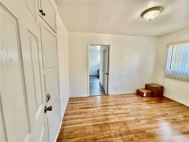 1526 Lakme Ave, Wilmington, CA 90744 - unfurnished room with light wood-type flooring and baseboards