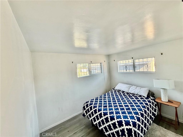1526 Lakme Ave, Wilmington, CA 90744 - bedroom featuring baseboards and wood finished floors